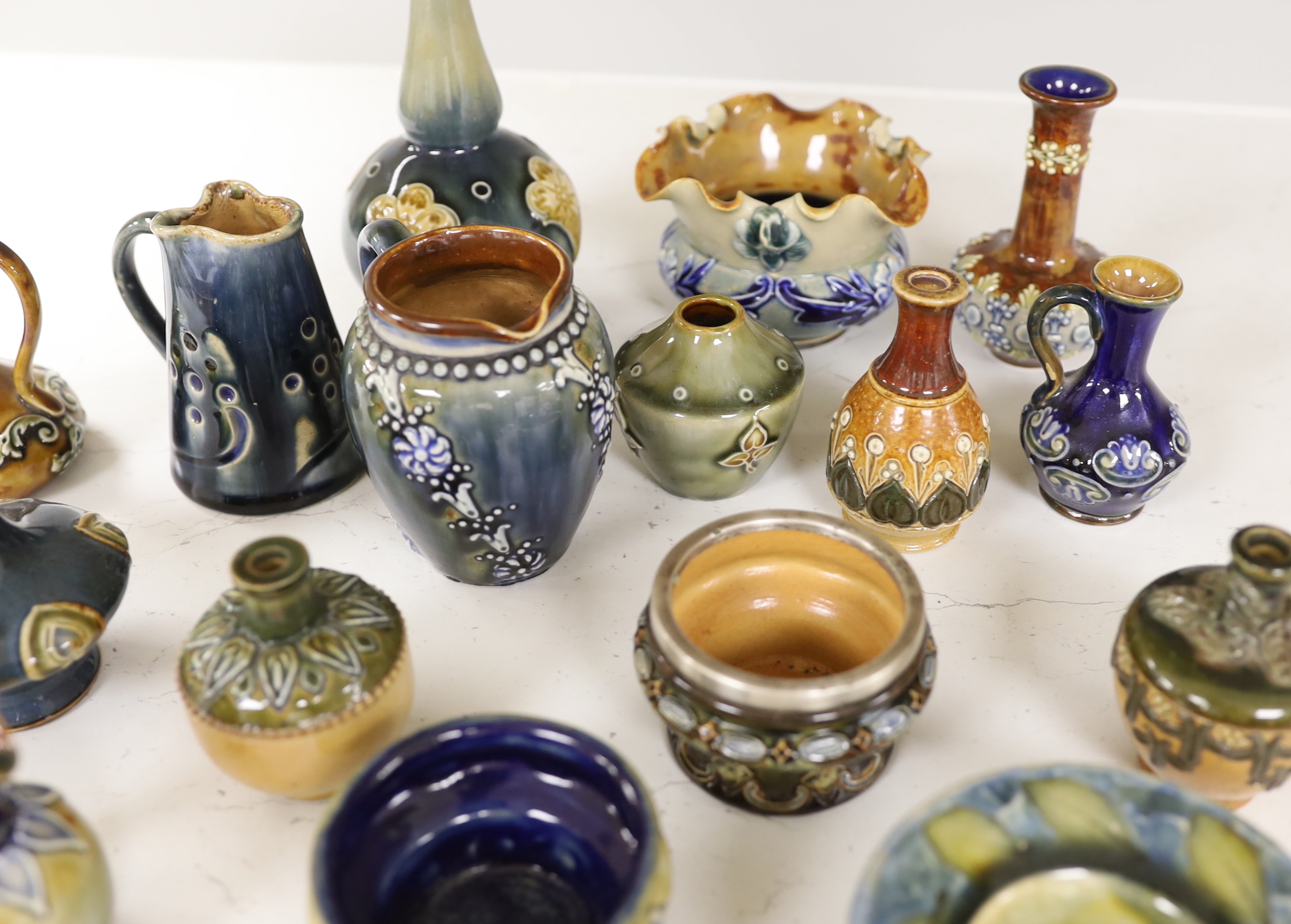 Sixteen miniature Doulton Stoneware items including bowls, vases, jugs, etc., tallest, 14.5cm